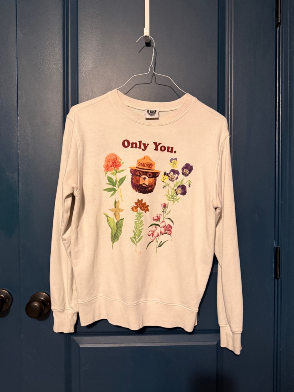 Mighty Fine Cream Crewneck Sweatshirt with Smokey Bear Floral Graphic